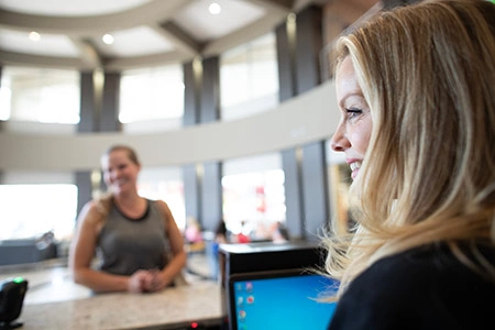 front desk staff behind counter